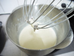 repeat the scraping and whisking process once or twice more at least, until the ice cream is smooth and nearly even frozen
